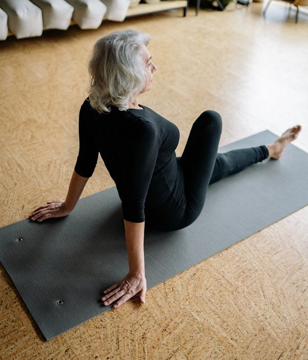 Person practicing a gentle yoga stretch to increase flexibility.